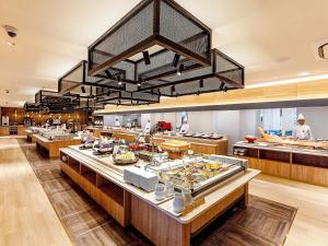 a restaurant with a buffet line with food on display at Yukai Resort Premium Hotel Senjo in Shirahama