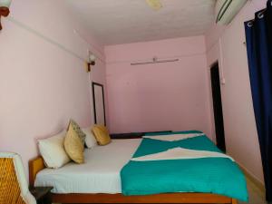 Voodi või voodid majutusasutuse Shiva Guest House toas