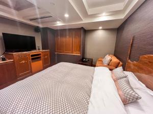 Lova arba lovos apgyvendinimo įstaigoje Hotel Crystal Gate Nagoya - Couple Hotel