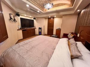 Lova arba lovos apgyvendinimo įstaigoje Hotel Crystal Gate Nagoya - Couple Hotel