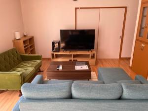 TV a/nebo společenská místnost v ubytování GuestHouse　YOU&I