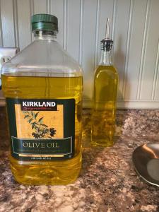 a bottle of olive oil sitting on a counter at Charming 3 Bedroom home with chimney & RV parking in East Wenatchee