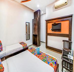 Postel nebo postele na pokoji v ubytování Fabhotel Glorify Palace - Nr Mumbai International Airport