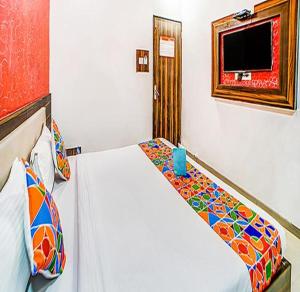 Postel nebo postele na pokoji v ubytování Fabhotel Glorify Palace - Nr Mumbai International Airport + 16 fotografií
