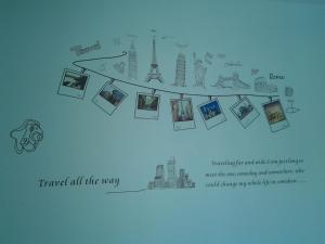 a map of the world with pictures of monuments at Makerhouse Hostel in Hefei