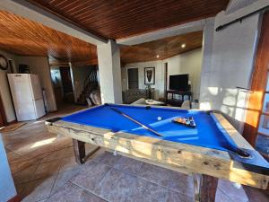 a pool table in the middle of a living room at Grobler's Haven Self catering cottage in Pretoria