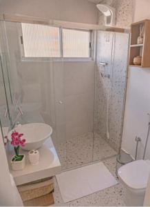 a bathroom with a shower and a sink and a toilet at Castelli Studios centro SP in Sao Paulo