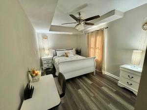 a bedroom with a bed and a ceiling fan at DreamStay in Dacula