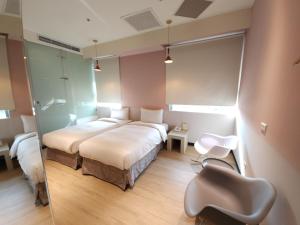 Rúm í herbergi á Merryday Hotel Banqiao