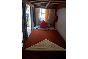Postel nebo postele na pokoji v ubytování Gedhong Hostel