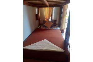 Postel nebo postele na pokoji v ubytování Gedhong Hostel