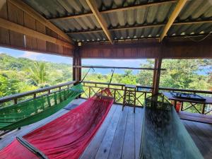 two hammocks on the deck of a tree house at Sweet View Guesthouse in Kaôh Rŭng (3)