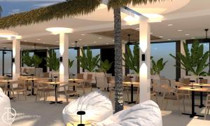 een restaurant met tafels en stoelen en palmbomen bij Golden Star Relax Hotel - Adults Only 16 plus in Tigaki