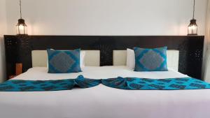 Postel nebo postele na pokoji v ubytování Marrakesh Hua Hin Resort & Spa