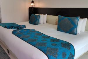 Postel nebo postele na pokoji v ubytování Marrakesh Hua Hin Resort & Spa