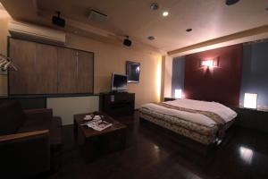 Postel nebo postele na pokoji v ubytování Hotel Mio Plaza (Adult Only)