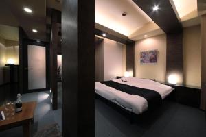 Postel nebo postele na pokoji v ubytování Hotel Mio Plaza (Adult Only)