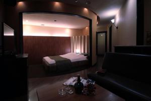 Postel nebo postele na pokoji v ubytování Hotel Mio Plaza (Adult Only)