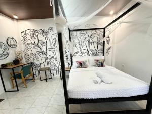 Postel nebo postele na pokoji v ubytování Mahajab Homestay SIARGAO