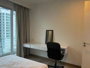 MyRehat Suites Bukit Ceylon tesisinde bir odada yatak veya yataklar