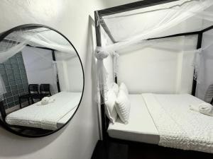 Postel nebo postele na pokoji v ubytování Mahajab Homestay SIARGAO