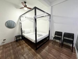 Postel nebo postele na pokoji v ubytování Mahajab Homestay SIARGAO