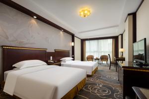 Μια τηλεόραση ή/και κέντρο ψυχαγωγίας στο Gem Flower Hotel - North Bund