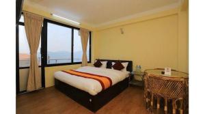 Rúm í herbergi á Hotel Bihani