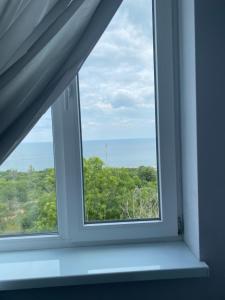 a window with a view of the ocean at Dinamo in Odesa