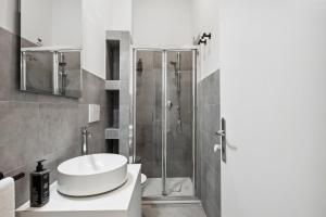 a bathroom with a sink and a shower at limehome Rome via dei Reti in Rome