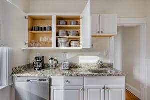 a kitchen with white cabinets and a sink at South Boston 3br fully furnished equipped BOS-928 in Boston