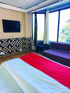 Lova arba lovos apgyvendinimo įstaigoje Hotel Plaza Dalhousie - Near Ghandhi Chowk Mall Road