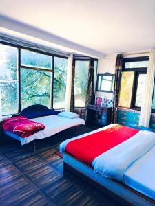 Lova arba lovos apgyvendinimo įstaigoje Hotel Plaza Dalhousie - Near Ghandhi Chowk Mall Road