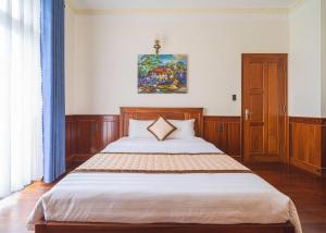 Postel nebo postele na pokoji v ubytování Dieu Thong Hotel