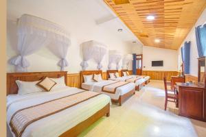 Postel nebo postele na pokoji v ubytování Dieu Thong Hotel