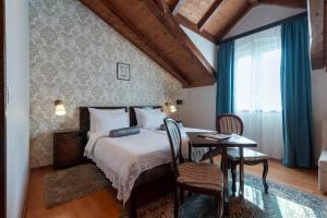 Katil atau katil-katil dalam bilik di Heritage Hotel Pasike