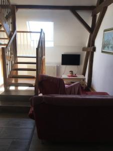 TV a/nebo společenská místnost v ubytování Maisonette Wohnung am Hänferdorf