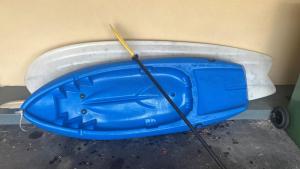 a blue boat with a paddle in a bath tub at Rosebud Beach Unit 200 mt to Beach Late checkout in Rosebud