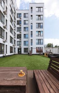 a large building with a large yard in front of it at Nyvky Like Home - Studio - apt 40 apt 46 in Kyiv