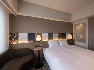 insomnia KYOTO OIKE客房内的一张或多张床位