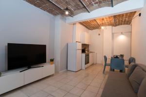 a living room with a large flat screen tv at Jeppson home in Terni