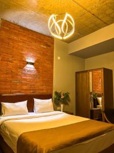 Rúm í herbergi á TM Apart Hotel