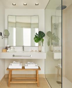 a bathroom with a sink and a mirror at Meliá Lloret de Mar in Lloret de Mar