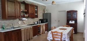 a kitchen with a sink and a table in it at The Lover House in Terni