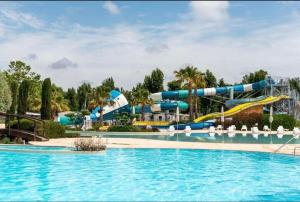a water park with a water slide at Mobilhome Vias plage dans Camping in Vias