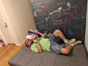 a man laying on the floor with a box on his head at Central and Affordable Williamsburg Private bedroom Close to Subway in Brooklyn