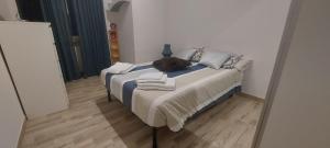 a large bed in a room with a mirror at La mia Marì in Palestrina