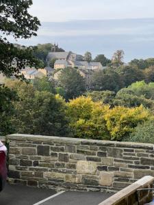 a stone retaining wall with a city in the background at Long term offers Message for prices Sleeps 6 Adults, Contractors, Relocators, Travellers in Halifax