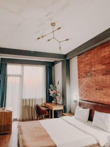 Postel nebo postele na pokoji v ubytování TM Apart Hotel