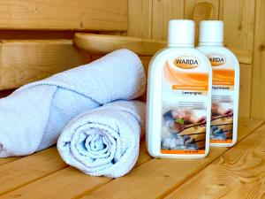 a pair of towels and a bottle of laundry detergent at Schacht85 in Oberhausen